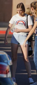 College babe in the parking lot in little denim shorts