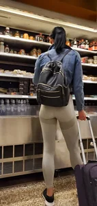 Beautiful brunette shopping in tight grey spandex with a great ass