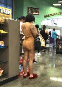 Latina with hard nipples and a big booty in tight spandex shorts outfit
