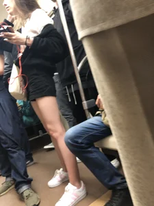 Girl in Shorts with Hot Skinny Legs in a Subway Train Candid