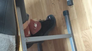 Legs in Tight Jeans and Feet in Shoes And Cute Socks, Under Desk Closeups of a College Teen in Class