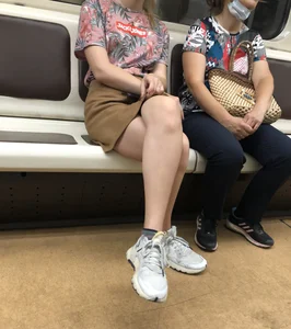 Amazing Hot Girl in a Skirt and Sneakers Sitting Cross-Legged in the Subway Train and on the Escalator Candid Photos Gallery