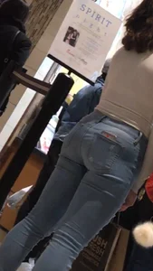 Girl in jeans in the mall food court
