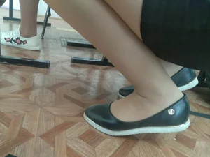 College Teen's Legs And Feet in Flats Closeups in the Classroom