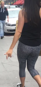 Sexy girl walking in grey patterned leggings with friend in tight jeans