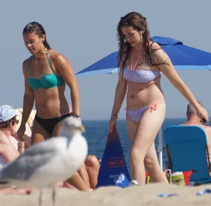 2 cute friends in bikinis on the beach