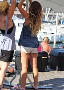 Sexy blonde girl in short white shorts