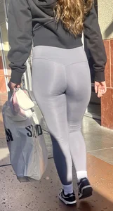 Sexy girl in grey leggings showing ass and cameltoe