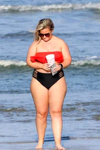 Thick BBW blonde lady in a bikini at the beach