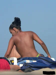 Hot ass topless beach girl with great tits lets her little brother oil up her ass in thong bikini
