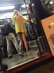 Hot Blonde with Long Skinny Legs Behind the Closing Doors of the Tram