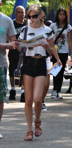 Skinny blonde chick in little denim shorts