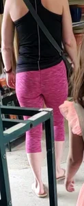 Milf shopping with a nice ass in tight maroon leggings