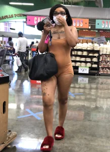 Latina with hard nipples and a big booty in tight spandex shorts outfit