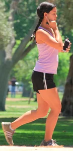 Hot brunette running in short shorts with vpl