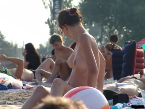 A bunch of sexy beach voyeur babes in bikinis, thongs and topless