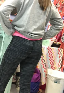 Ass standing around in tight grey patterned leggings