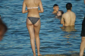Wet Girl with Hot Body in Swimsuit Standing by the Water on the Beach Creepshot Gallery