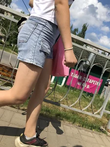 Cute Girl in Denim Shorts Walking Down a Railway Station Gallery