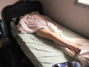 Girl Asleep in Bed With Her Leg Sticking Out of the Blanket Home Creepshot