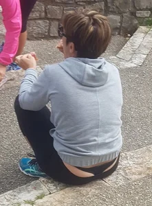 Short haired milf sitting showing her thong