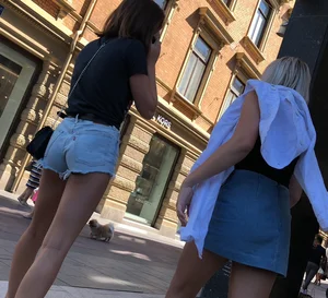 Shorts girl walking with nice legs and some cheeks showing