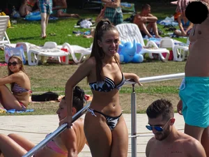 Sexy girl at the pool with a nice ass in thong bikini