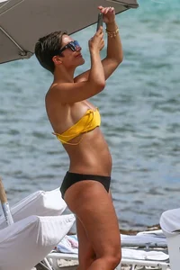 Frankie Bridge nip slips in a bikini on the beach