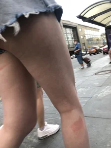 Street closeup of really hot legs and booty in fringed shorts