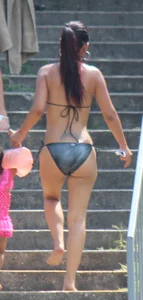Sexy brunette milf in a bikini with a great body, nice ass and some camel toe