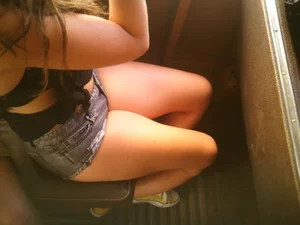 Sexy girl on the bus in jean shorts with nice legs and cleavage