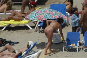 Girls on a nude beach in Sitges, Spain