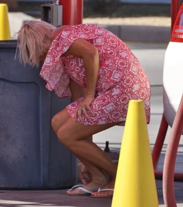 Sexy blonde upskirted in pink dress while cleaning her car