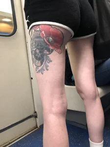 A Tall And Slim Candid Girl in Spandex Shorts in a Hoodie Top, With Tattoos on Her Long Legs Subway Creepshots
