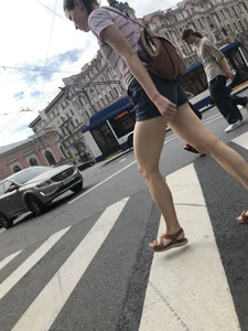 Young Girl in Shorts And Sandals Crossing the Street Gallery