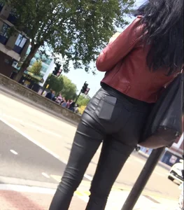 Chav brunette with a nice ass and vpl in tight black leather pants