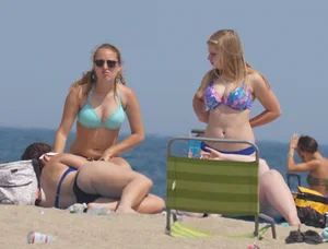 3 girls on the beach in bikinis with big boobs, one brunette and two blondes