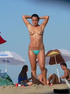 2 topless thonged sexy friends on the beach with great bodies