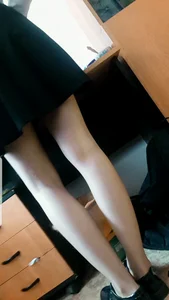 Thin Pale Legs of a Teen College Student in a Dress - Closeup Candid Photos in Classroom
