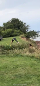 Fit Girl in Yoga Pants Working Out in the Field