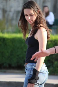 Hot brunette skateboarder in tight jeans and with hard nipples