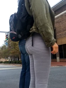 College girl in striped leggings walking with nice ass