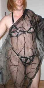 Naked chunky milf in a BDSM outfit sneaky pic