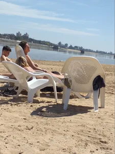 Blonde beach girl with a great ass in pink thong bikini