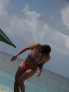 Lady with big tits wearing pink thong on the beach