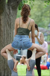 Gymnast or yoga girl in the park in shorts and no bra and even showing some pussy