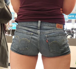 Teen in jean short shorts standing in line