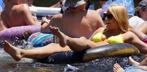 Sexy party girls in bikinis on a lake