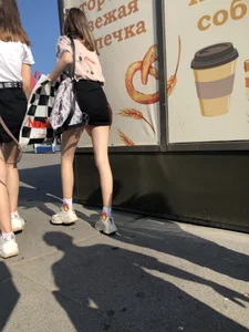 Couple of Skinny Girls in Mini-Skirts And Sneakers Street Photos