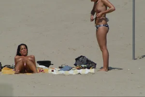 Girls on a nude beach in Sitges, Spain